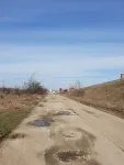 Teren Intravilan stradal DE 70 Isalnita, langa pensiune - Miniatura 4